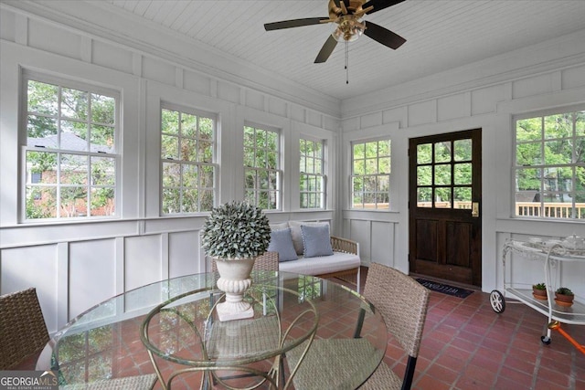 6104 Floyd St NE, Covington, GA 30014 - sunroom with a decorative wall, crown molding, tile patterned floors, and healthy amount of natural light