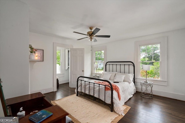 6104 Floyd St NE, Covington, GA 30014 - bedroom featuring multiple windows, wood finished floors, and baseboards