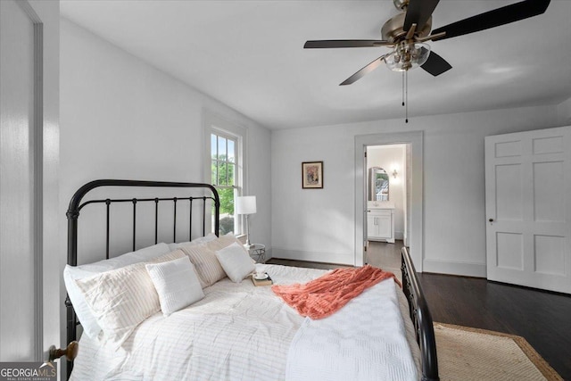 6104 Floyd St NE, Covington, GA 30014 - bedroom with wood finished floors, baseboards, connected bathroom, and a ceiling fan