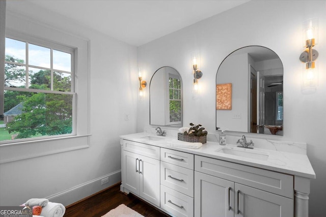 6104 Floyd St NE, Covington, GA 30014 - bathroom featuring plenty of natural light, double vanity, and wood finished floors
