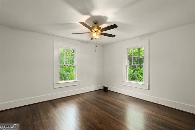 6104 Floyd St NE, Covington, GA 30014 - unfurnished room with plenty of natural light, dark wood finished floors, baseboards, and a ceiling fan