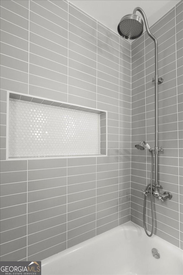 6104 Floyd St NE, Covington, GA 30014 - full bathroom featuring a shower and a tub to relax in