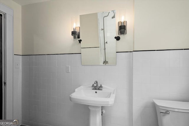 6104 Floyd St NE, Covington, GA 30014 - bathroom with toilet and tile walls