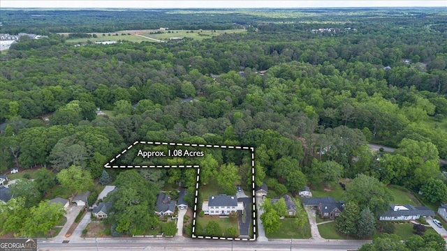 6104 Floyd St NE, Covington, GA 30014 - view of property location with a heavily wooded area and property parcel outlined