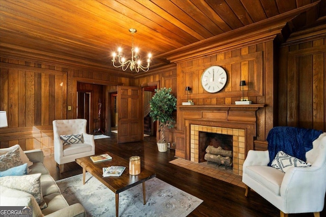 6104 Floyd St NE, Covington, GA 30014 - living area with wooden walls, a chandelier, ornamental molding, a fireplace, and wood ceiling