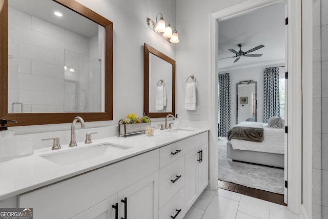 full bathroom with double vanity, a sink, a ceiling fan, and ornamental molding