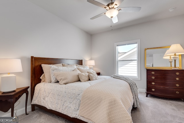 bedroom with baseboards, light carpet, and ceiling fan