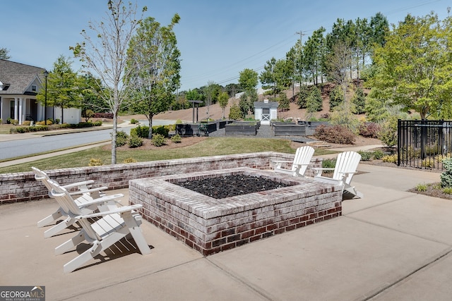 view of patio / terrace featuring fence and an outdoor fire pit