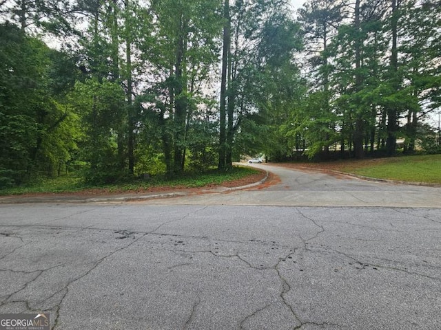 view of road with curbs