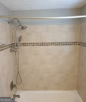 full bathroom featuring washtub / shower combination
