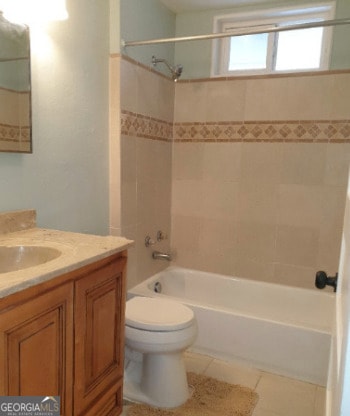 full bathroom with vanity, tile patterned flooring, toilet, and tub / shower combination