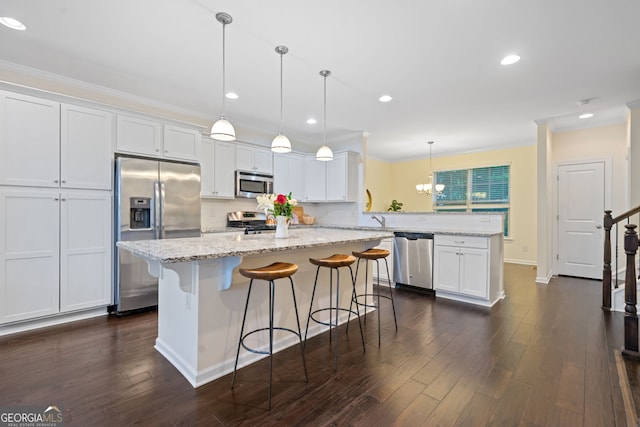 3231 Chutney Ct, Avondale Estates, GA 30002 - kitchen with crown molding, white cabinets, stainless steel appliances, and a peninsula