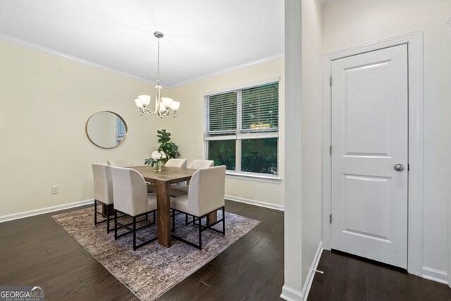 3231 Chutney Ct, Avondale Estates, GA 30002 - dining space featuring crown molding, dark wood-style flooring, baseboards, and an inviting chandelier