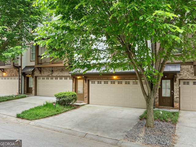 3231 Chutney Ct, Avondale Estates, GA 30002 - view of front of house featuring brick siding, driveway, and metal roof