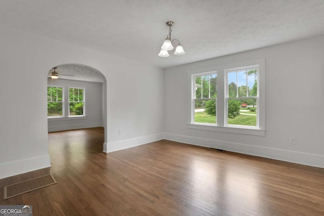 3223 Cleveland Hwy, Gainesville, GA 30506 - unfurnished room featuring visible vents, dark wood finished floors, baseboards, and a chandelier