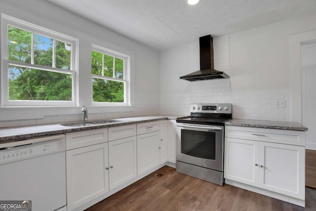 3223 Cleveland Hwy, Gainesville, GA 30506 - kitchen with wall chimney exhaust hood, stainless steel electric range, dishwasher, dark wood-style flooring, and white cabinetry