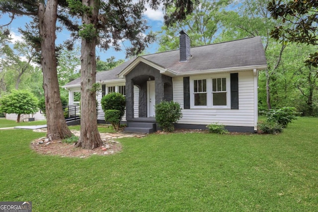 3223 Cleveland Hwy, Gainesville, GA 30506 - ranch-style home featuring roof with shingles, a chimney, and a front yard