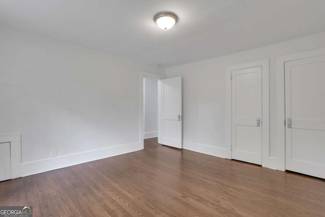 3223 Cleveland Hwy, Gainesville, GA 30506 - unfurnished bedroom featuring wood finished floors and baseboards