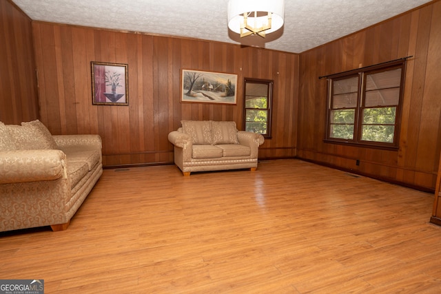305 Wolfe St, Dublin, GA 31021 - interior space with wooden walls, a healthy amount of sunlight, and light wood-style flooring