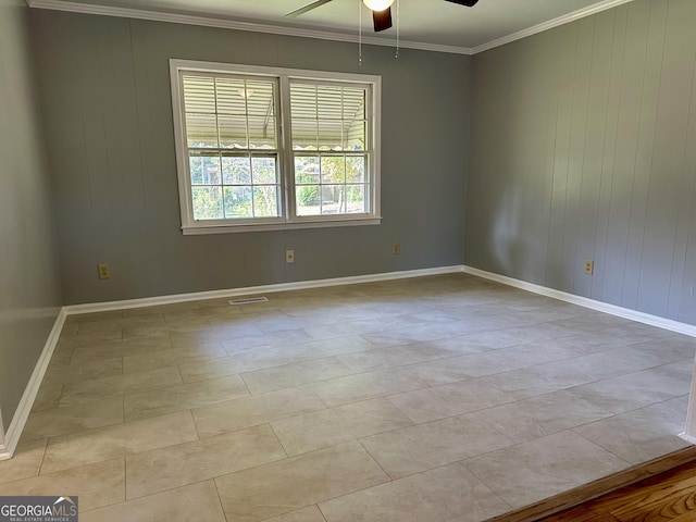 111 Howard St, Byron, GA 31008 - spare room featuring crown molding, baseboards, a ceiling fan, and wooden walls
