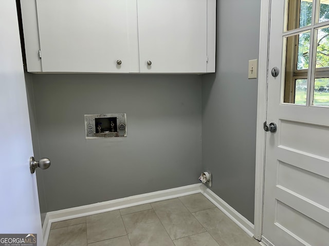 111 Howard St, Byron, GA 31008 - laundry room featuring baseboards, hookup for a washing machine, cabinet space, and plenty of natural light