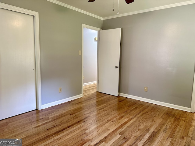 111 Howard St, Byron, GA 31008 - unfurnished bedroom featuring a ceiling fan, wood finished floors, baseboards, a closet, and ornamental molding