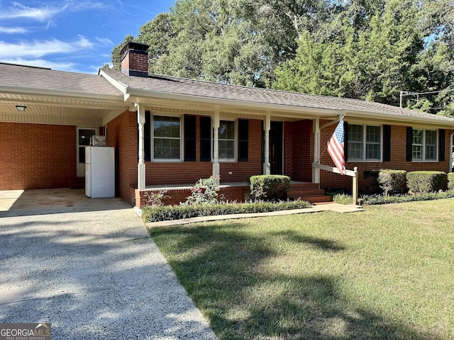 111 Howard St, Byron, GA 31008 - ranch-style home with driveway, a chimney, a carport, brick siding, and a front lawn