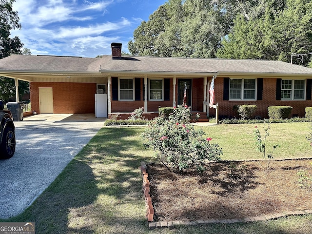 111 Howard St, Byron, GA 31008 - single story home featuring a chimney, an attached carport, driveway, and brick siding