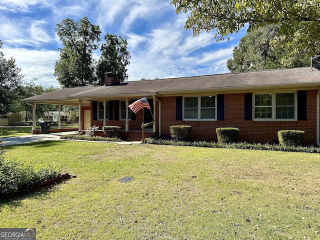 111 Howard St, Byron, GA 31008 - single story home featuring brick siding, a chimney, a front yard, and an attached carport
