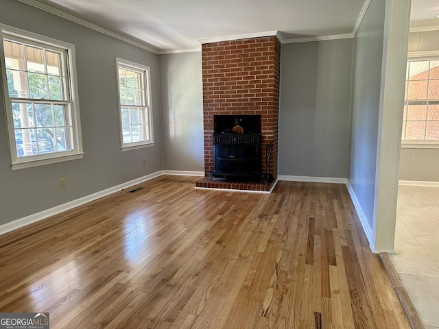 111 Howard St, Byron, GA 31008 - unfurnished living room featuring baseboards, ornamental molding, wood finished floors, and visible vents