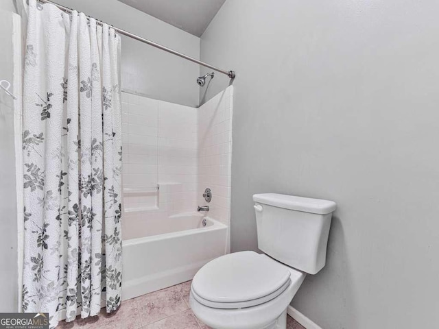 full bathroom featuring tile patterned floors, shower / bath combo, and toilet