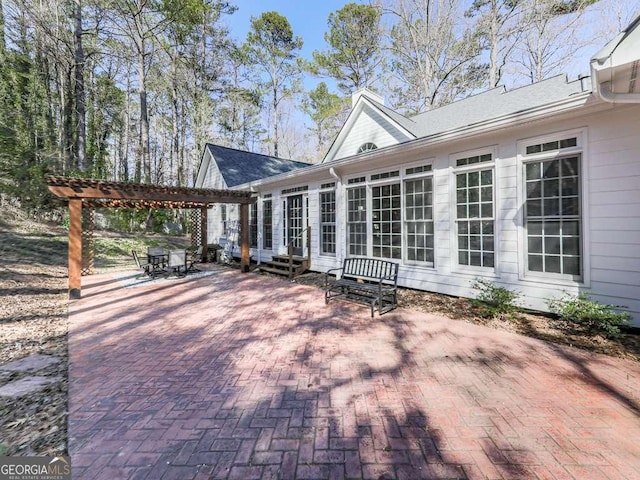 view of patio with a pergola and entry steps