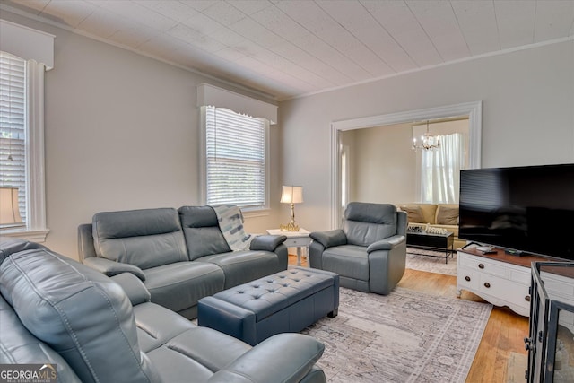 2327 Redwood Dr, Augusta, GA 30904 - living area featuring an inviting chandelier, plenty of natural light, light wood-style flooring, and crown molding