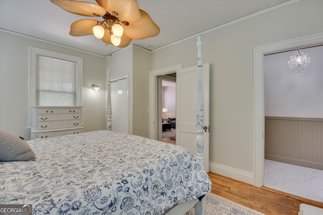 2327 Redwood Dr, Augusta, GA 30904 - bedroom featuring baseboards, a ceiling fan, light wood-style floors, and crown molding