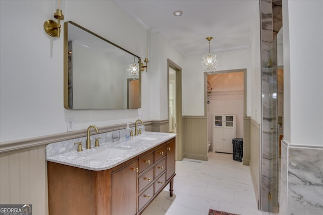 2327 Redwood Dr, Augusta, GA 30904 - full bath with a sink, a wainscoted wall, a notable chandelier, and marble finish floor