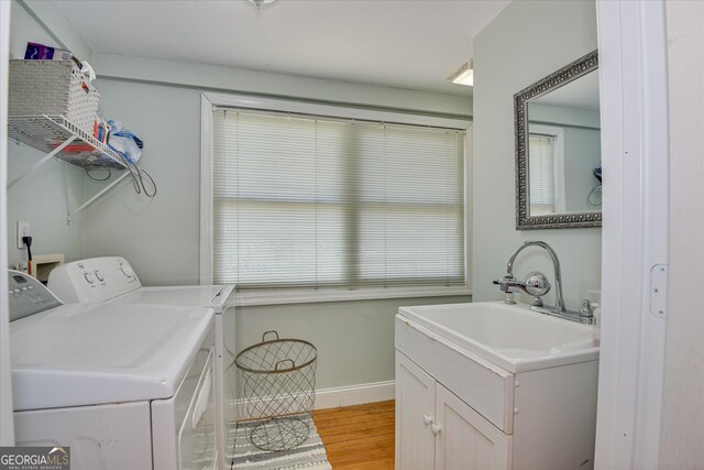 2327 Redwood Dr, Augusta, GA 30904 - laundry room featuring independent washer and dryer, laundry area, a sink, baseboards, and light wood-type flooring