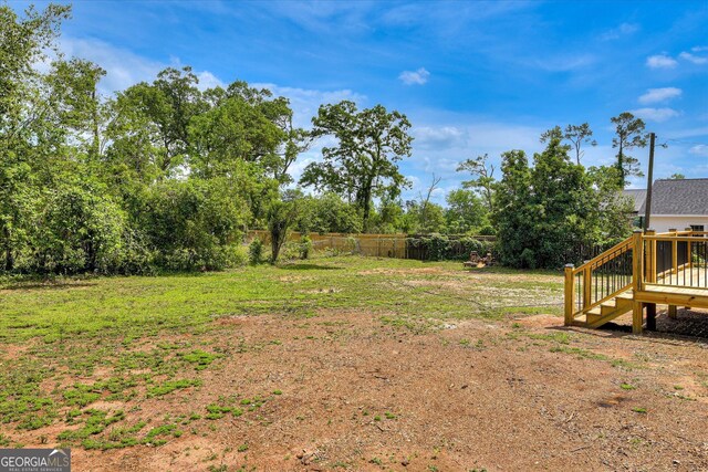 2327 Redwood Dr, Augusta, GA 30904 - view of yard with fence, a deck, and stairway