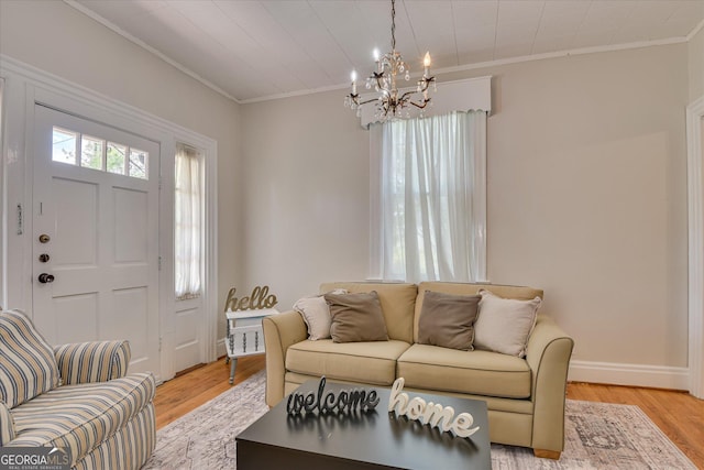 2327 Redwood Dr, Augusta, GA 30904 - living area with crown molding, baseboards, light wood-type flooring, and a notable chandelier