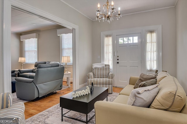 2327 Redwood Dr, Augusta, GA 30904 - living area with a notable chandelier, ornamental molding, and light wood-type flooring