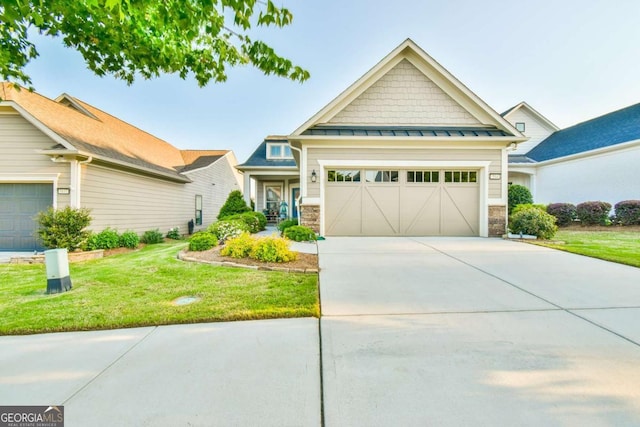 5641 Tisbury Ct, Hoschton, GA 30548 - craftsman inspired home with a standing seam roof, concrete driveway, a front lawn, and stone siding
