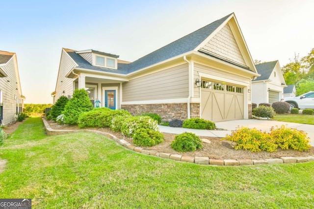 5641 Tisbury Ct, Hoschton, GA 30548 - view of front facade with a garage, a front lawn, stone siding, a shingled roof, and concrete driveway