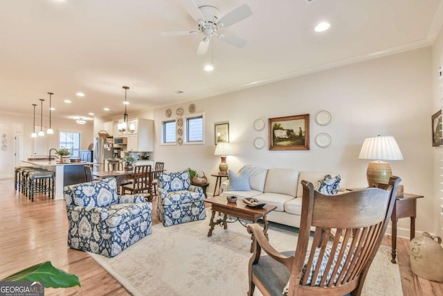 5641 Tisbury Ct, Hoschton, GA 30548 - living room with crown molding, recessed lighting, and light wood-style floors