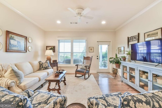 5641 Tisbury Ct, Hoschton, GA 30548 - living room with ceiling fan, recessed lighting, wood finished floors, visible vents, and ornamental molding