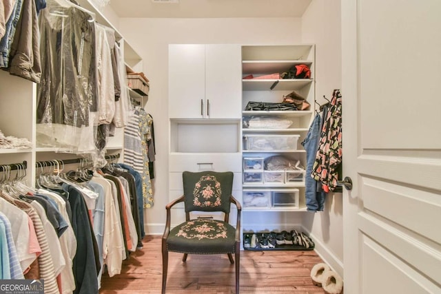 5641 Tisbury Ct, Hoschton, GA 30548 - walk in closet featuring wood finished floors