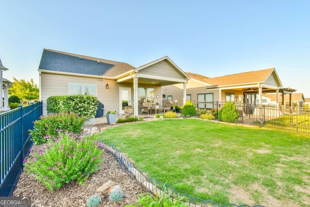 5641 Tisbury Ct, Hoschton, GA 30548 - back of house featuring a fenced backyard, a ceiling fan, a lawn, and a patio area