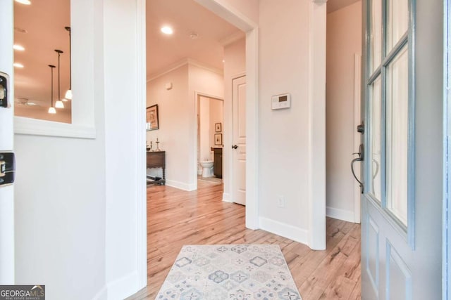 5641 Tisbury Ct, Hoschton, GA 30548 - entrance foyer featuring baseboards, ornamental molding, and light wood-style flooring