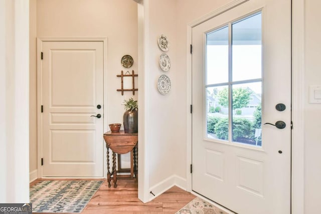 5641 Tisbury Ct, Hoschton, GA 30548 - entryway featuring baseboards and light wood-style flooring