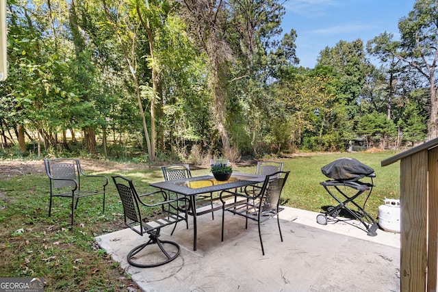 view of patio with outdoor dining space and grilling area