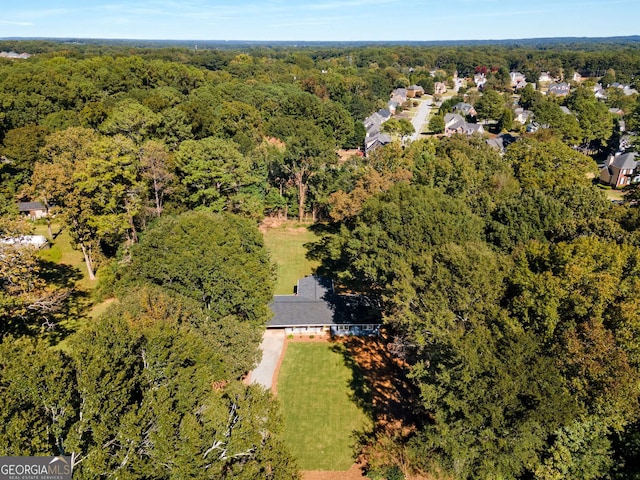 bird's eye view featuring a forest view