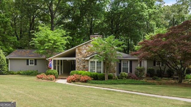 35 Saddle Mountain Rd SE, Rome, GA 30161 - view of front of home with stone siding, a chimney, and a front yard